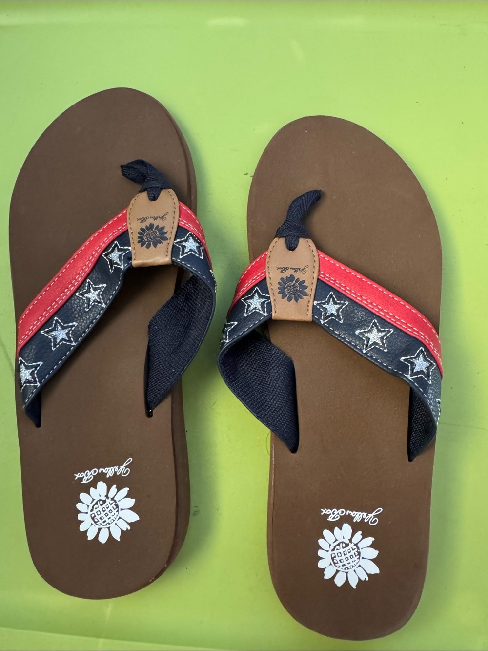 Yellow Box red white and blue flip flops